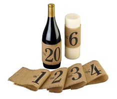 a bottle of wine next to burlocks with numbers on them