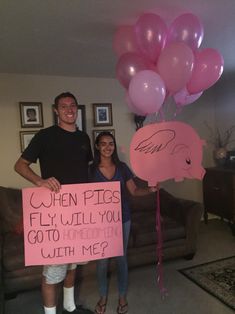 a man and woman holding pink balloons in their hands with a sign that says when pigs fly, will you go to bed together with me?