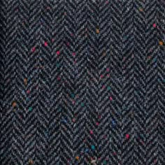 a close up view of a black and blue tweed fabric