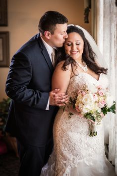 a bride and groom standing next to each other