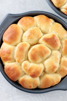 two cast iron skillets filled with bread