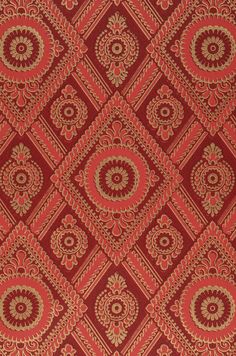 red and gold fabric with an intricate design