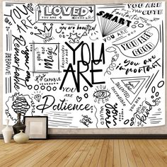 a wall mural with the words you are in black and white