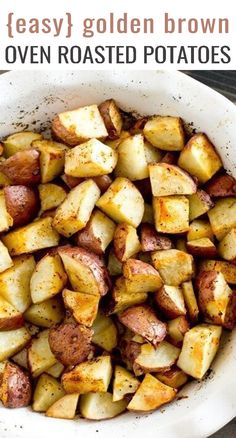 a white bowl filled with cooked potatoes on top of a wooden table and text overlay that reads easy golden brown oven roasted potatoes