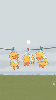 three teddy bears hanging on a clothes line with the moon in the sky behind them