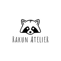 the raccoon atelier logo is black and white, with an animal's head