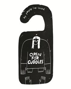 an open for cuddles door hanger on a white background with black writing