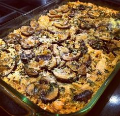 a casserole dish filled with mushrooms and cheese