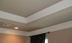 an image of a room with white trim on the ceiling