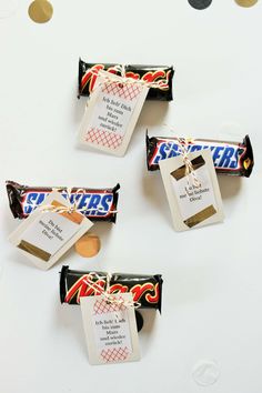 three hers candy bars with price tags on them