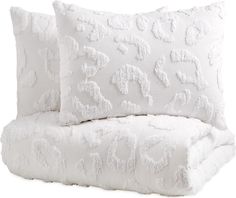 two white pillows sitting next to each other