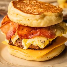 a bacon, egg and cheese breakfast sandwich on a plate