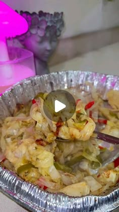 a metal pan filled with food on top of a table