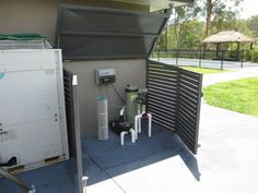 an open air conditioner on the side of a building