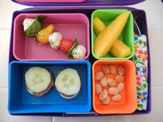 a lunch box filled with fruits and vegetables