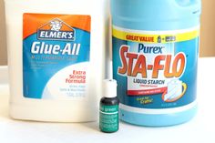 two bottles of glue sitting next to each other on top of a white countertop