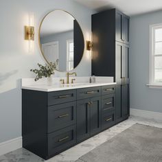 a bathroom with two sinks and a large mirror on the wall above it's cabinets