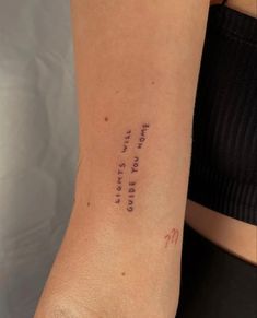 a woman's arm with writing on it