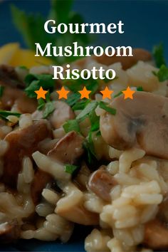 mushroom risotto on a blue plate with lemon wedges and parsley in the background