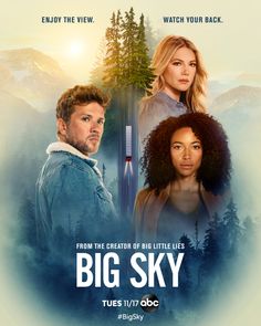 the movie poster for big sky with two people standing in front of trees and mountains