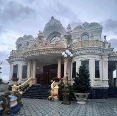 an ornately decorated house with steps leading up to it