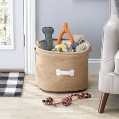 a dog toy storage basket on the floor