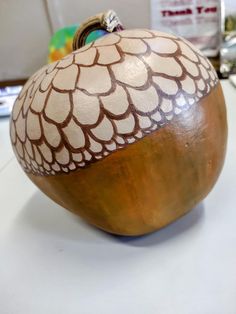 an acorn shaped object sitting on top of a table