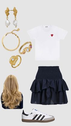 a white shirt, black skirt and gold accessories