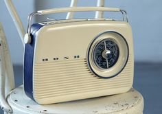 an old fashioned radio sitting on top of a chair