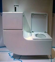 a white toilet and bidet in a room