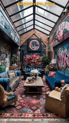 a living room filled with furniture and graffiti covered walls