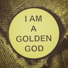 i am a golden god sticker on the side of a yellow and black jacket