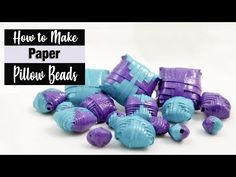 purple and blue plastic beads with the words how to make paper pillow beads on it