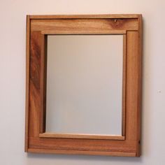 a mirror mounted to the side of a wall