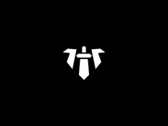 a black and white logo with the letter t in it's center, on a dark background