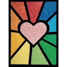 a stained glass window with a heart on it's center and rainbow colors in the background