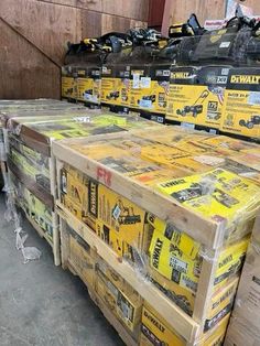 boxes are stacked on top of each other in a storage room filled with construction materials