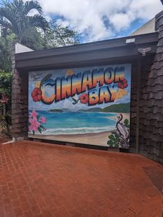 a mural on the side of a building that says cinnamon bay