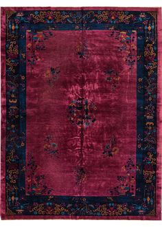 a red rug with blue and pink accents