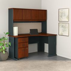 an office desk with two drawers and a computer monitor