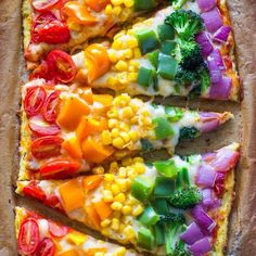 a pizza with many different toppings cut into slices and arranged on top of each other