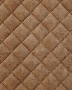 an up close view of a brown quilted material with diamond design on the edges