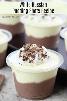 white russian pudding shots recipe in plastic cups with whipped cream and chocolate shavings