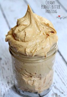 a jar filled with peanut butter sitting on top of a table