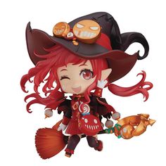 a doll with red hair wearing a witches hat and holding a pumpkin in her hand