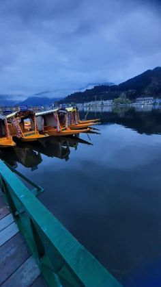 there are many small boats docked at the dock