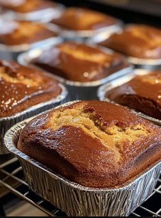 several muffins cooling in tins on a rack