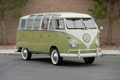 an old vw bus parked in front of a building