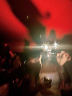 two people are holding sparklers in their hands