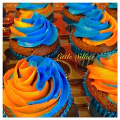 cupcakes with blue and orange frosting on top